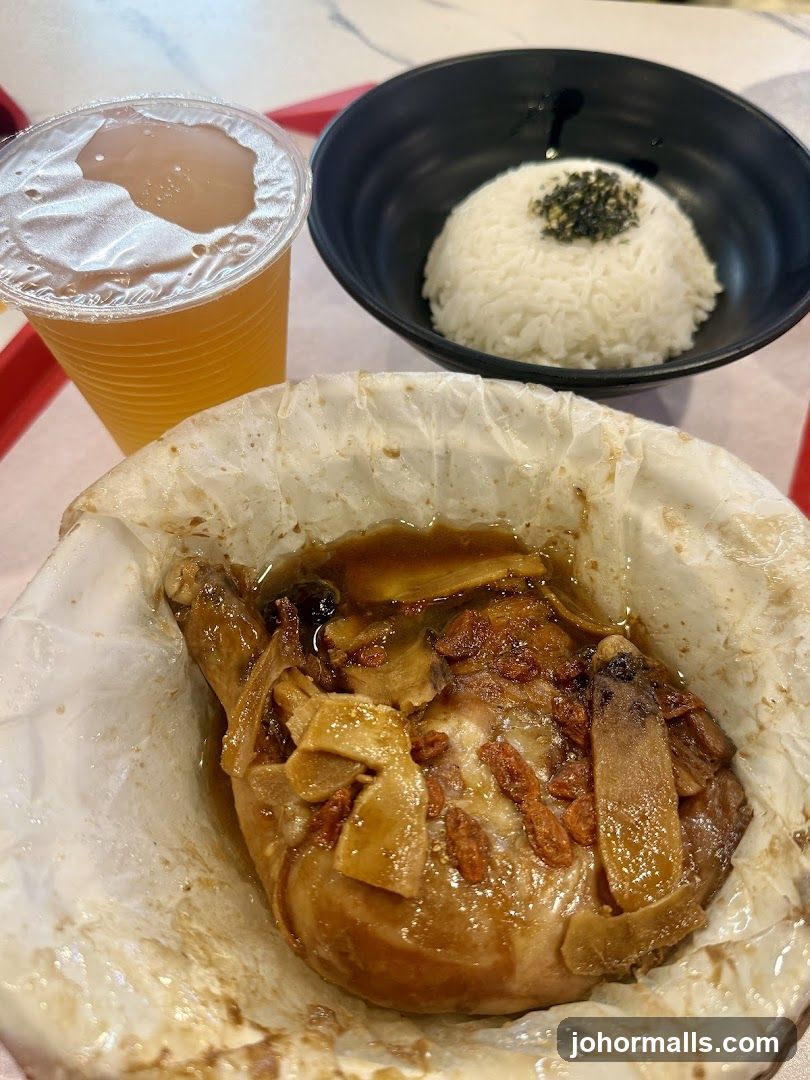 Chicken dish with rice and drink