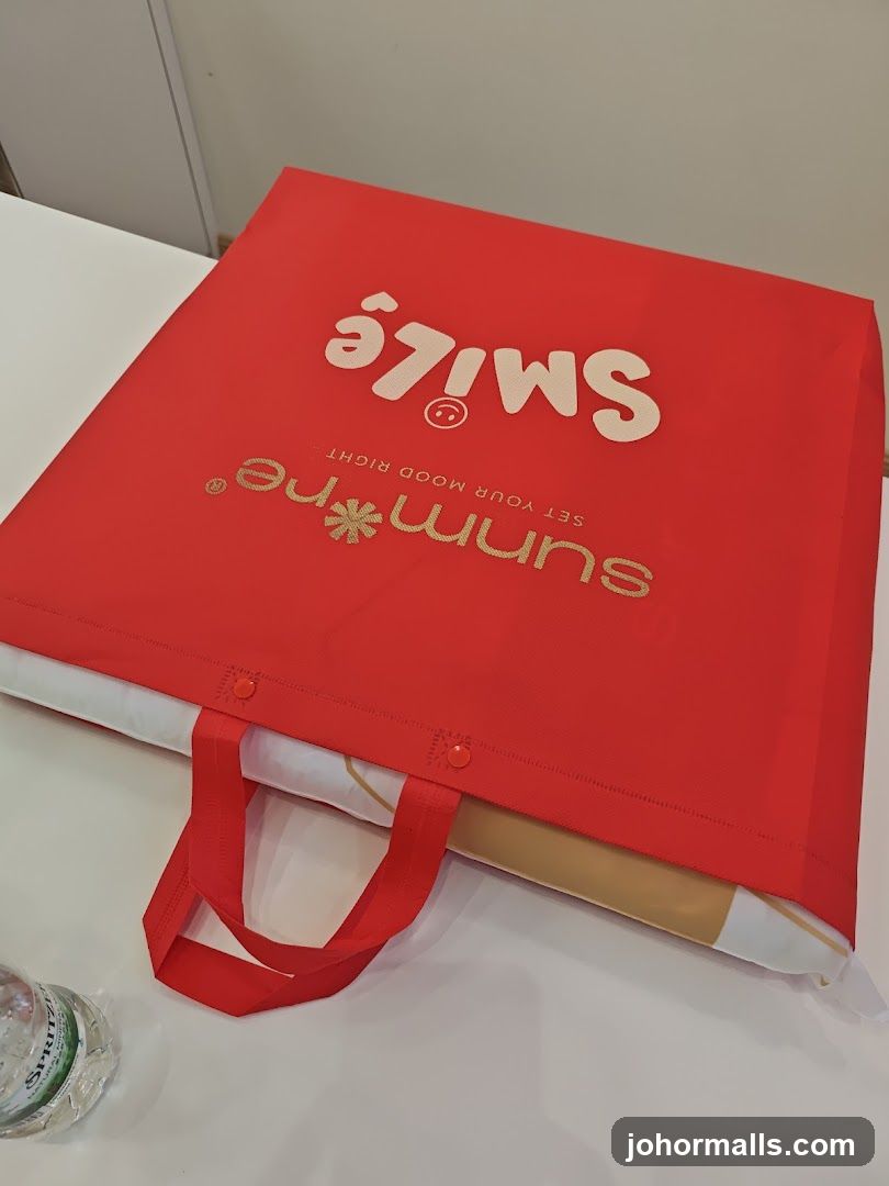 Red tote bag with branding