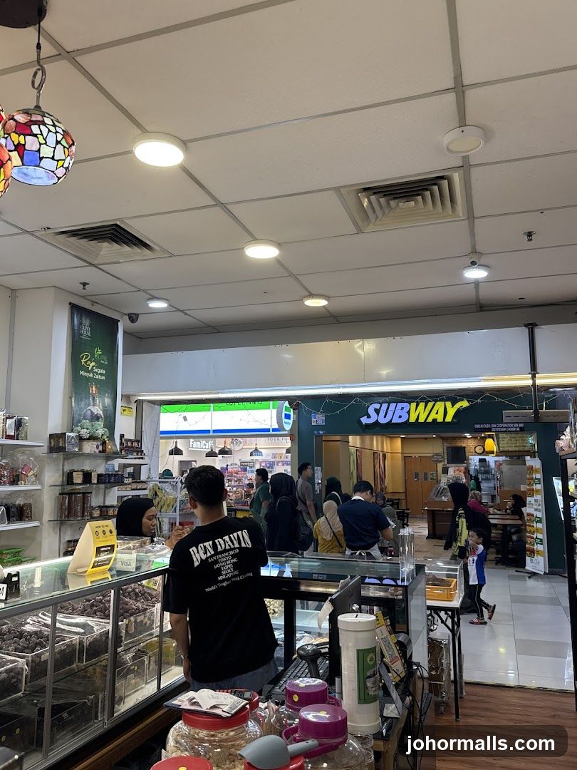 Interior of a shopping area with a Subway restaurant