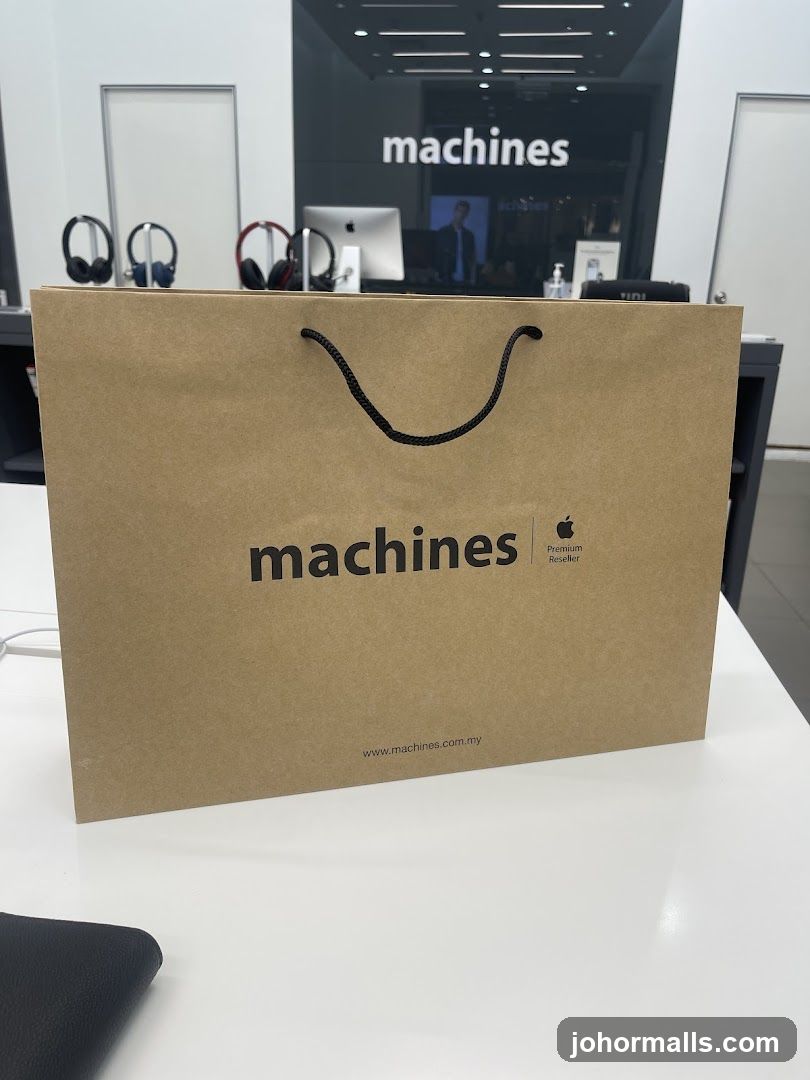 Brown paper shopping bag with "machines" logo
