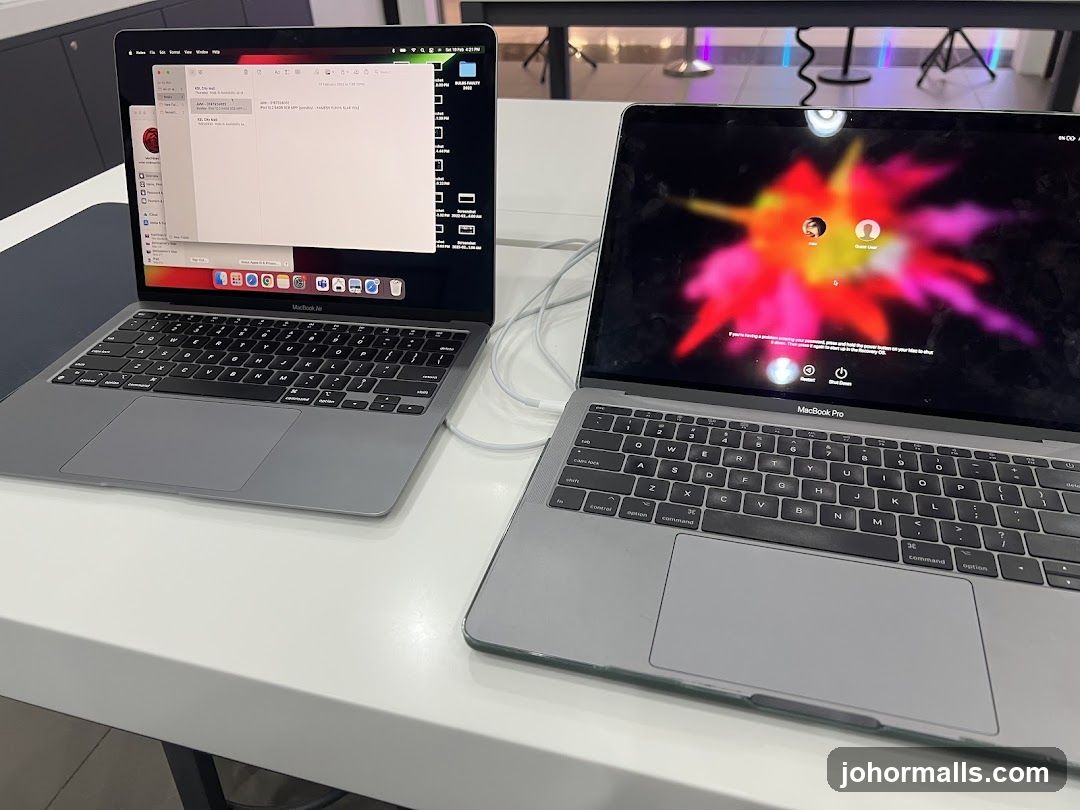 Two MacBooks on a table