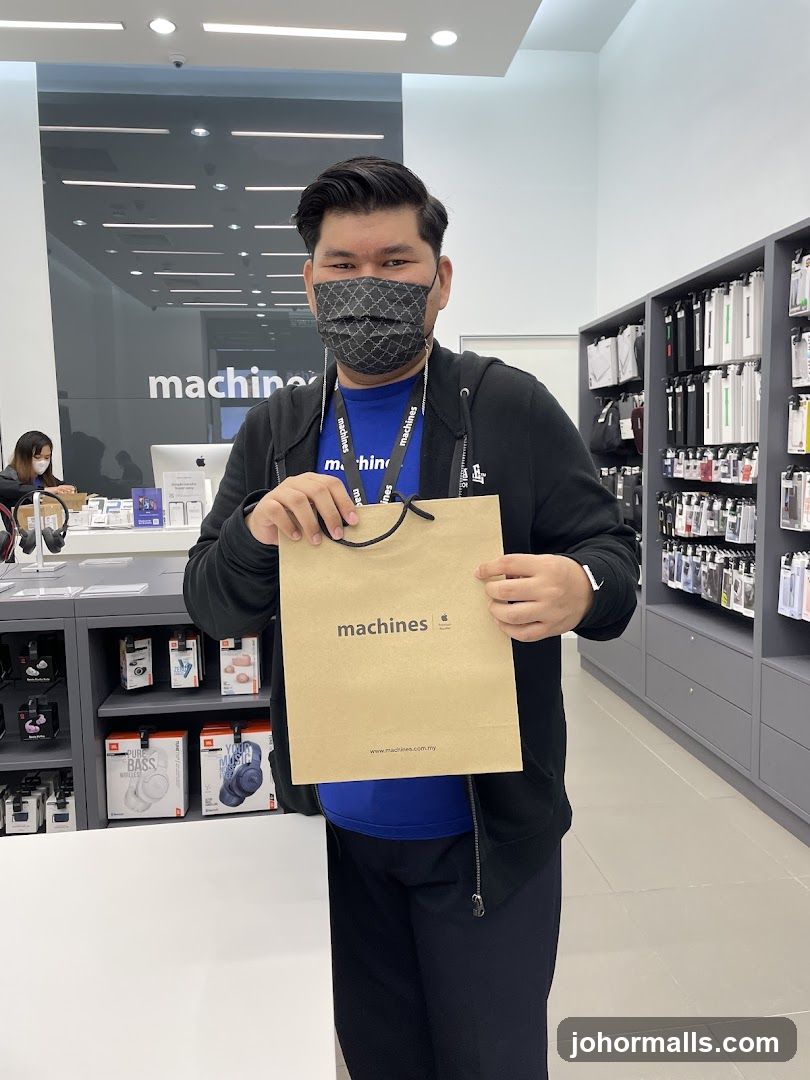 Man holding a shopping bag in a store
