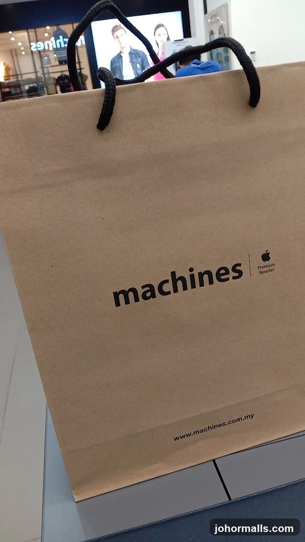 Brown paper shopping bag with "machines" logo