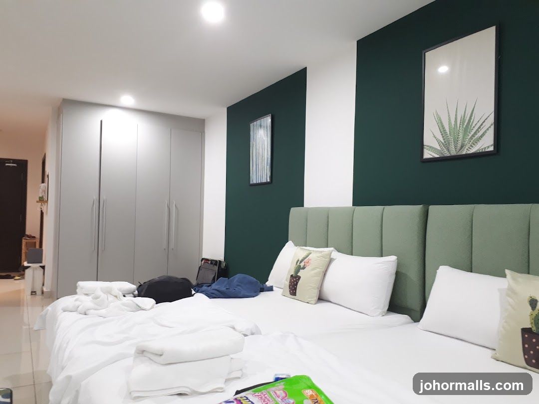 Bedroom with two beds and large wardrobe