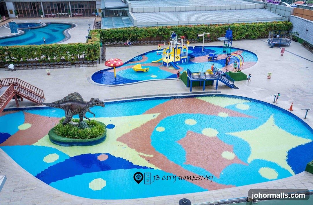 Water park with dinosaur statue