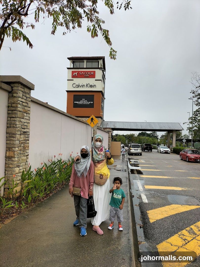 People walking outside a shopping complex