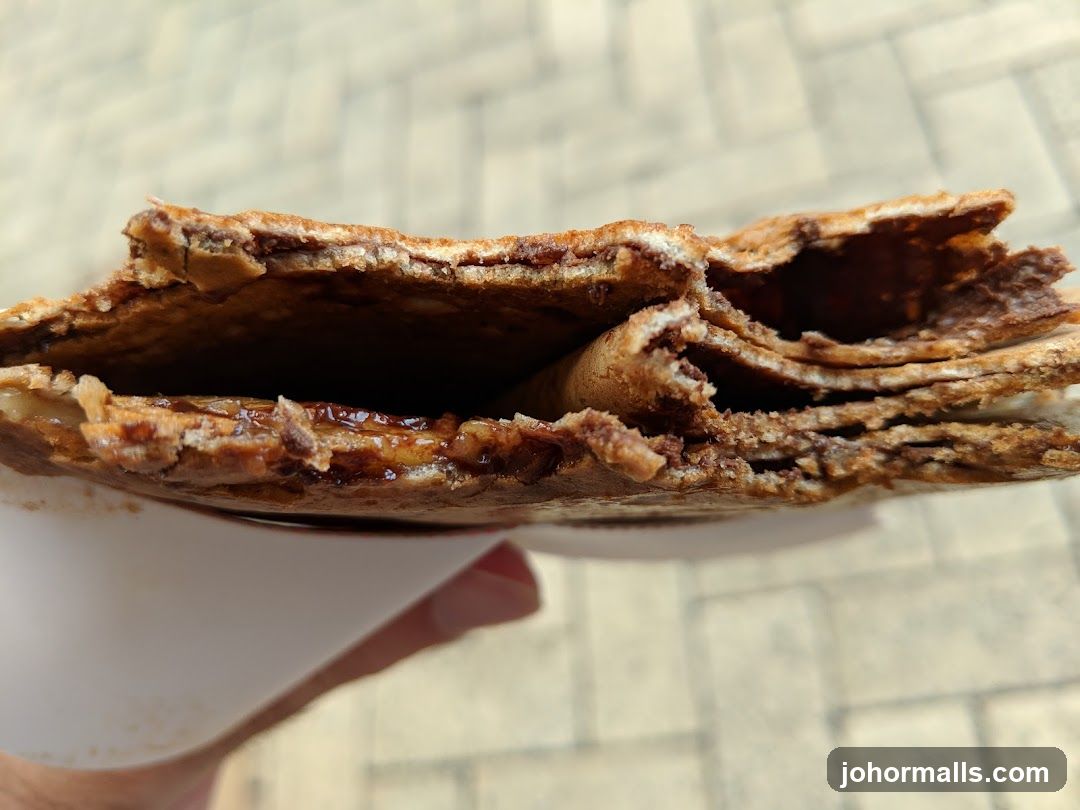 Close-up of a folded crepe with chocolate filling