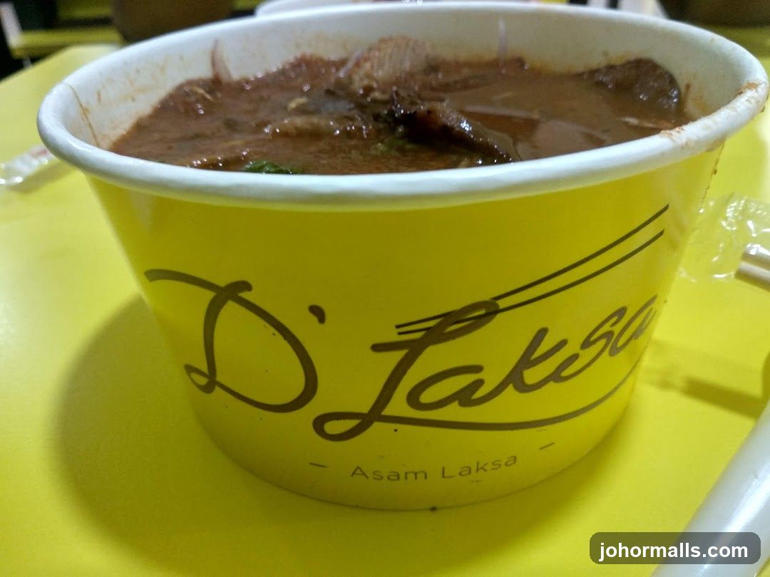 Asam Laksa in a Yellow Container