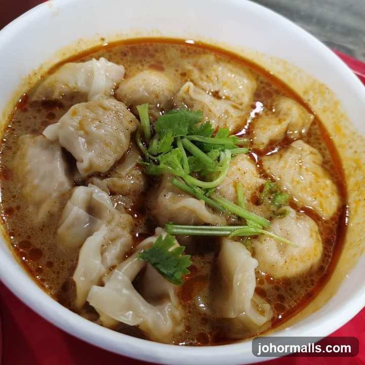 Bowl of Wontons and Meatballs in Broth