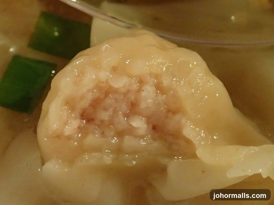 Close-up of a dumpling in broth