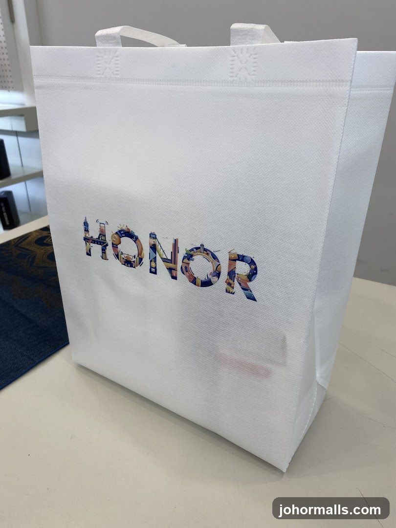 White tote bag with "HONOR" logo