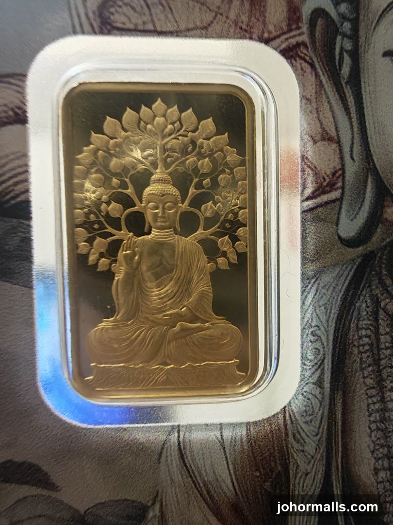 Gold bar with Buddha engraving