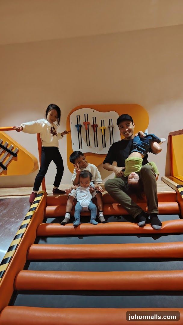 Family playing in a colorful indoor playground