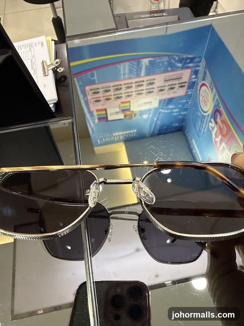 Sunglasses on a Mirrored Surface