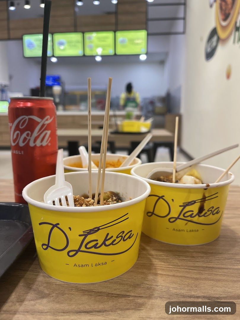 D'Laksa Asam Laksa Cups and Coca-Cola