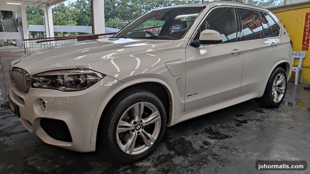 White BMW SUV at a Car Wash