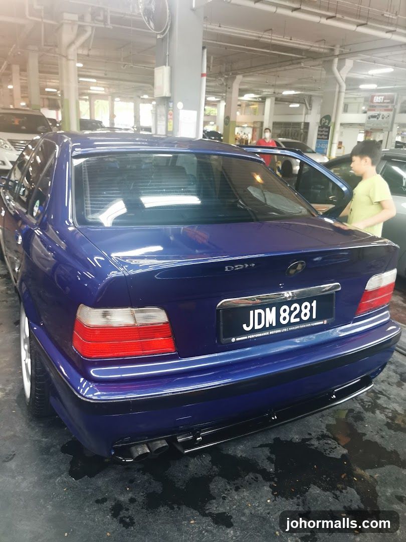 Blue BMW Sedan in Parking Garage