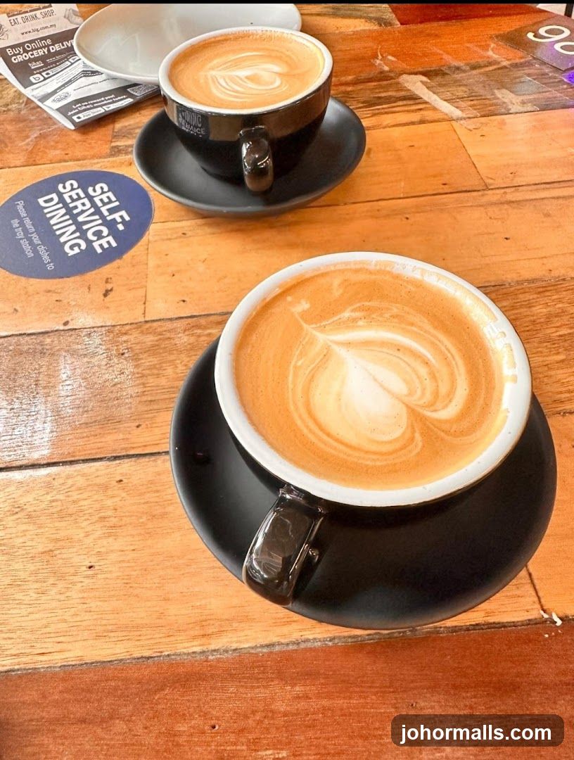 Two Lattes on a Wooden Table