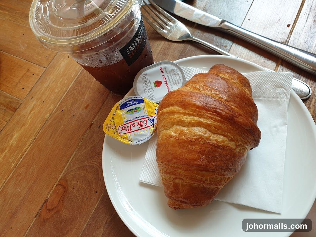 Croissant with Coffee and Condiments