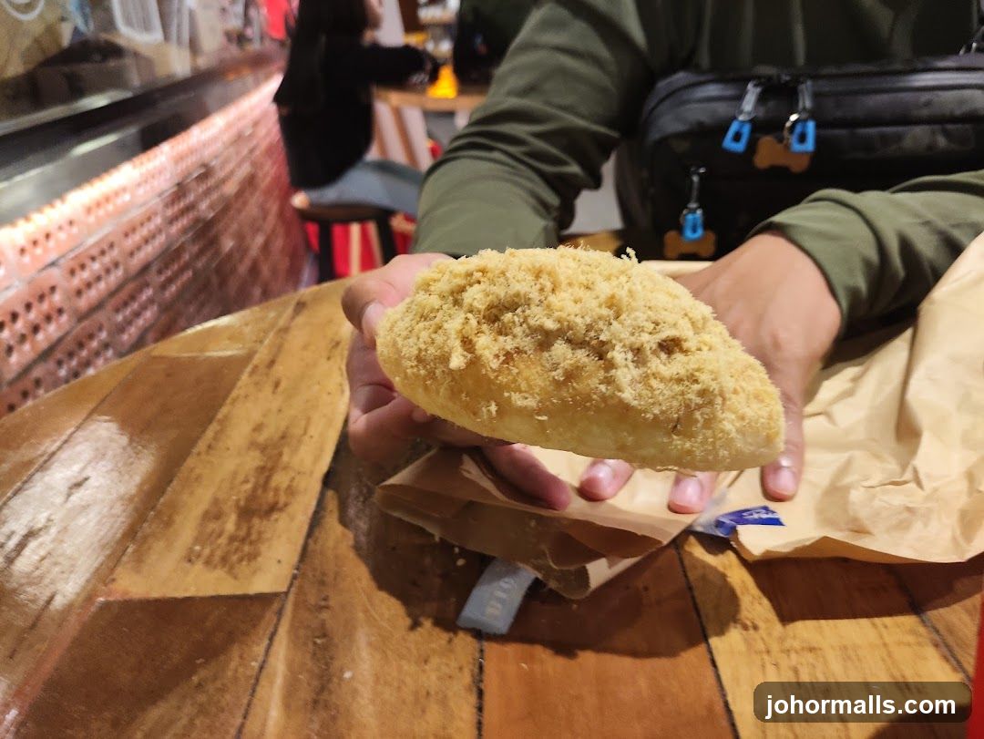 Person holding a pastry