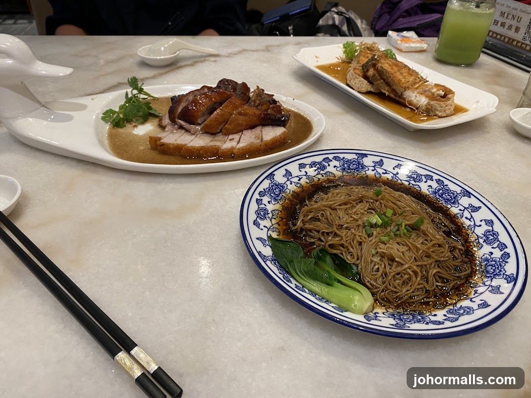 Table with Roasted Meats and Noodles