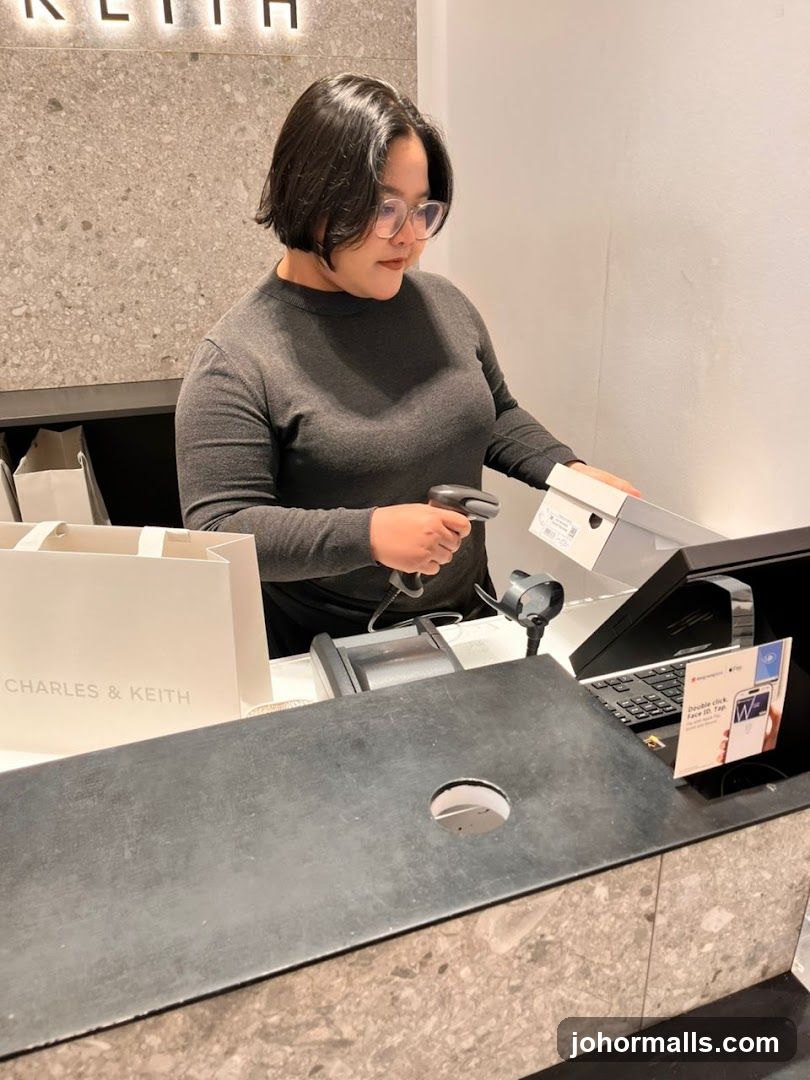 Cashier Scanning Shoe Box