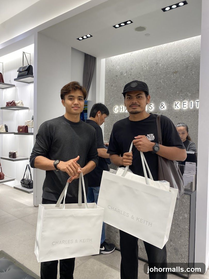 Two men holding shopping bags
