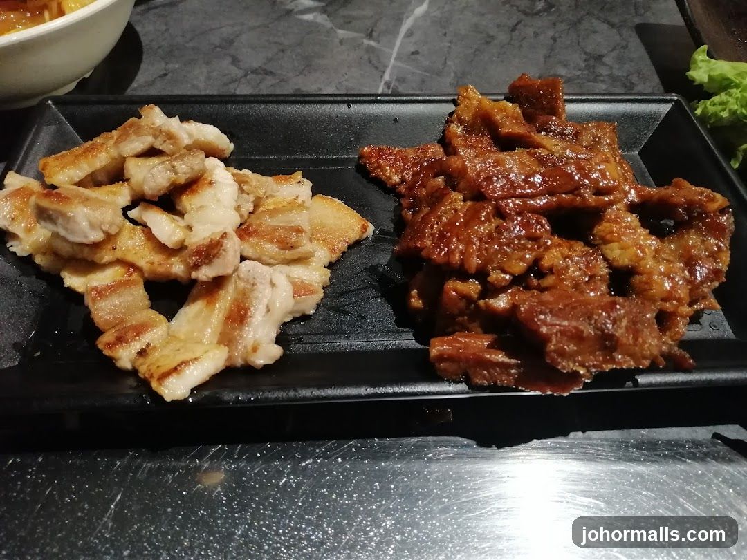 Two Plates of Cooked Meat
