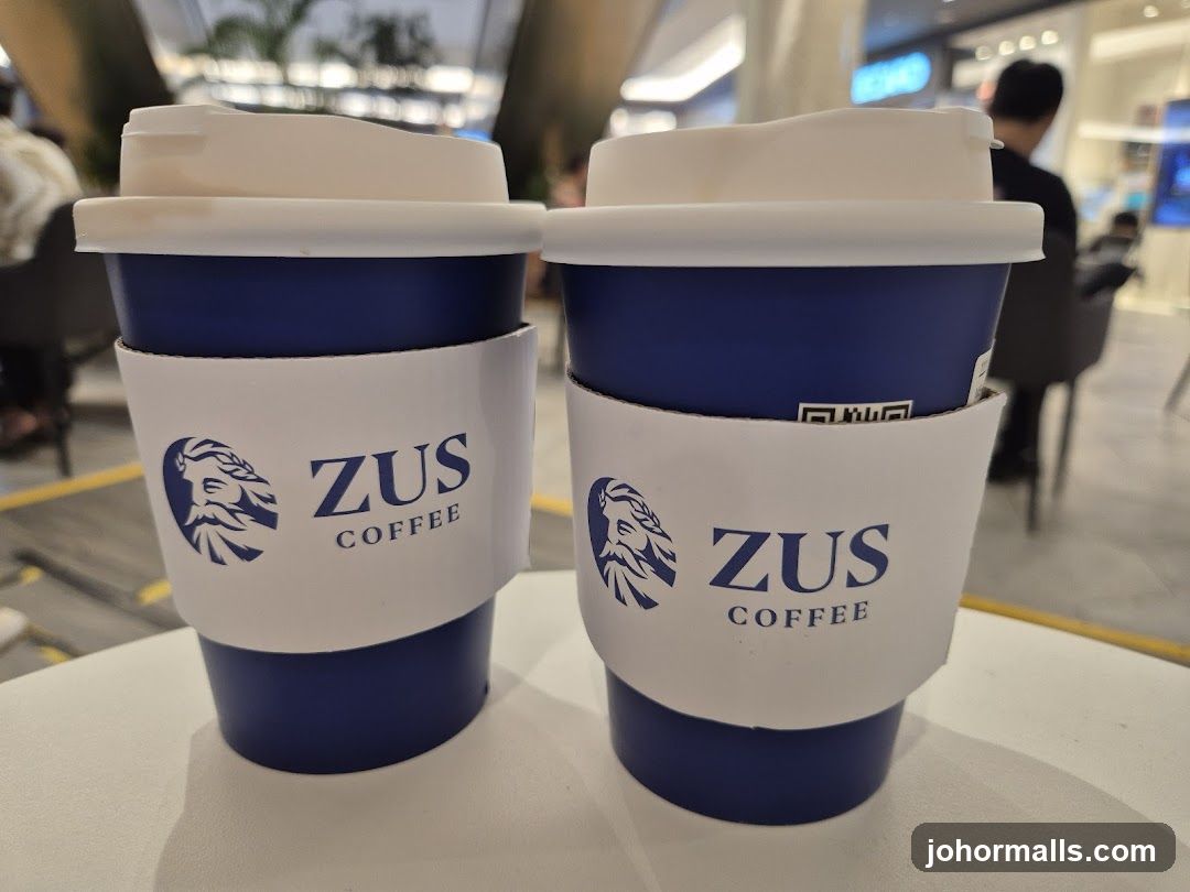 Two ZUS Coffee Cups