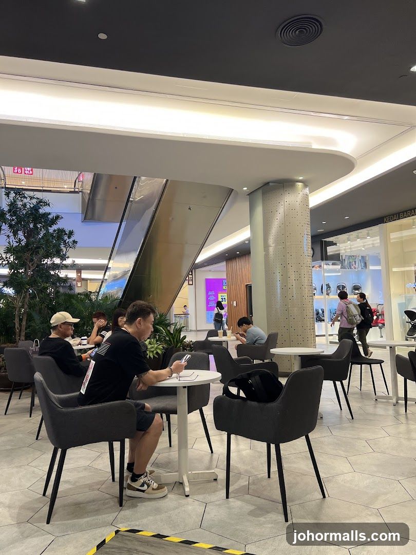 People sitting at tables in a cafe