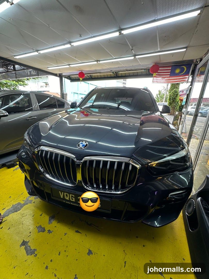Dark BMW parked indoors
