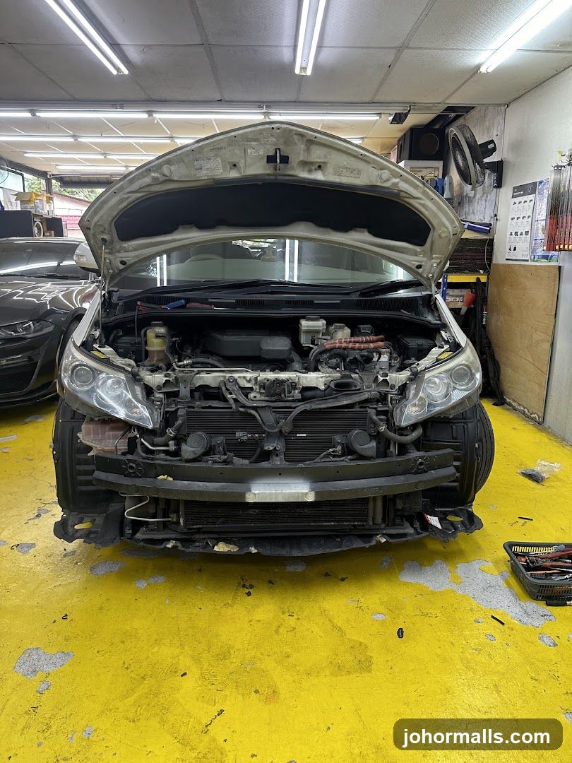 Car engine bay with hood open