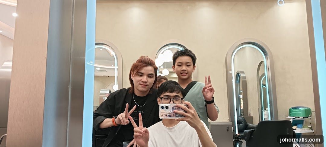 Three people taking a selfie in a salon