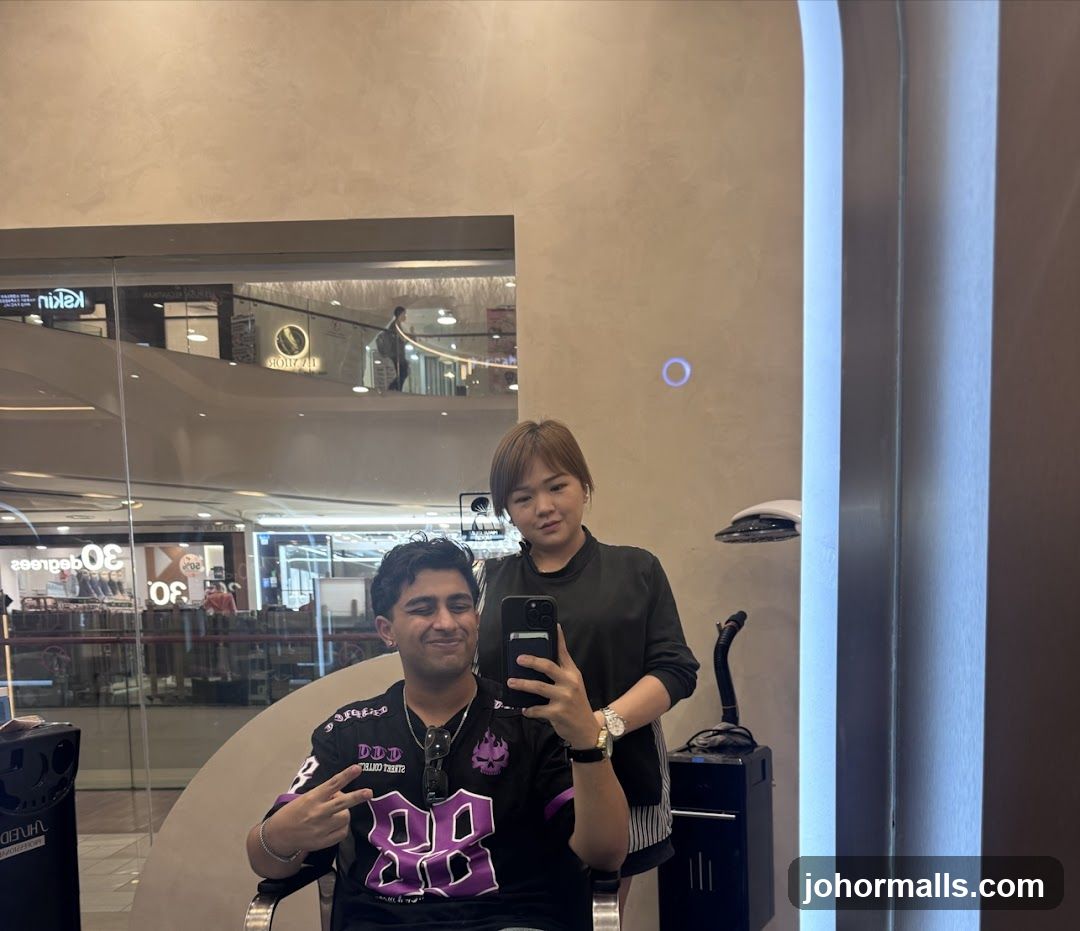 Man and Stylist Taking a Mirror Selfie