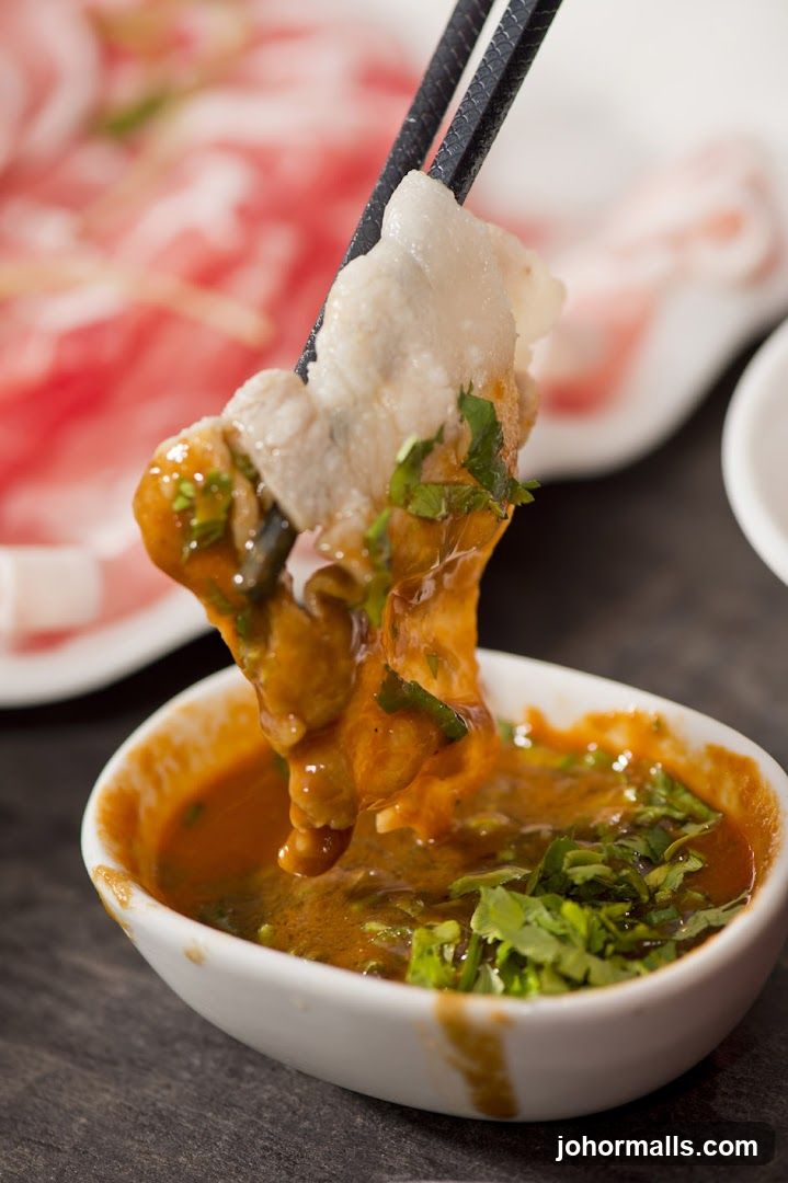 Dipping Meat in Sauce