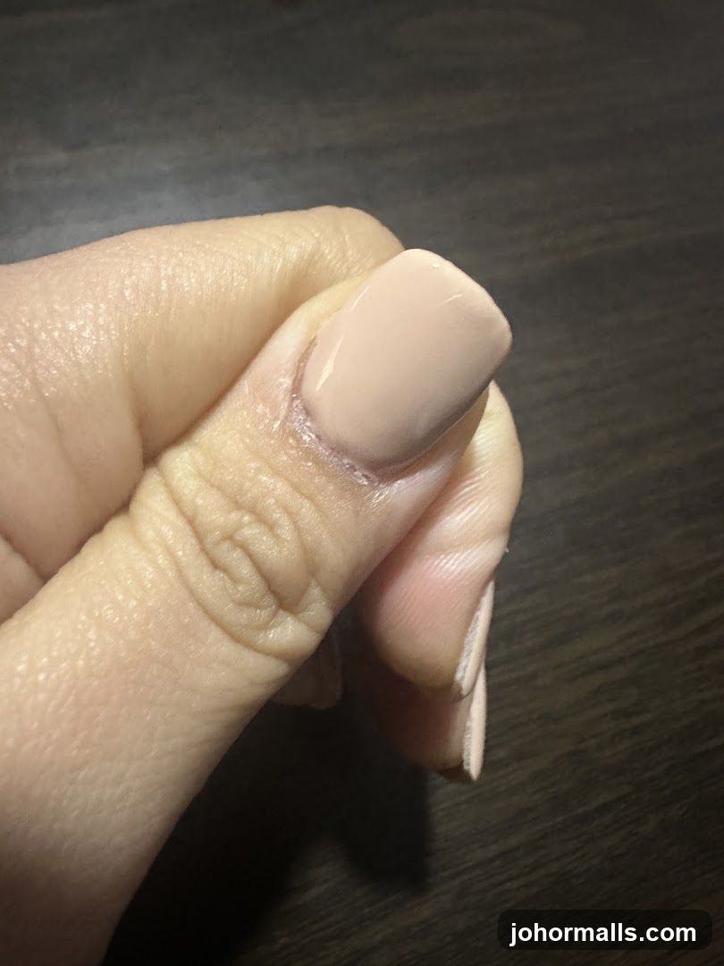Close-up of a manicured thumb