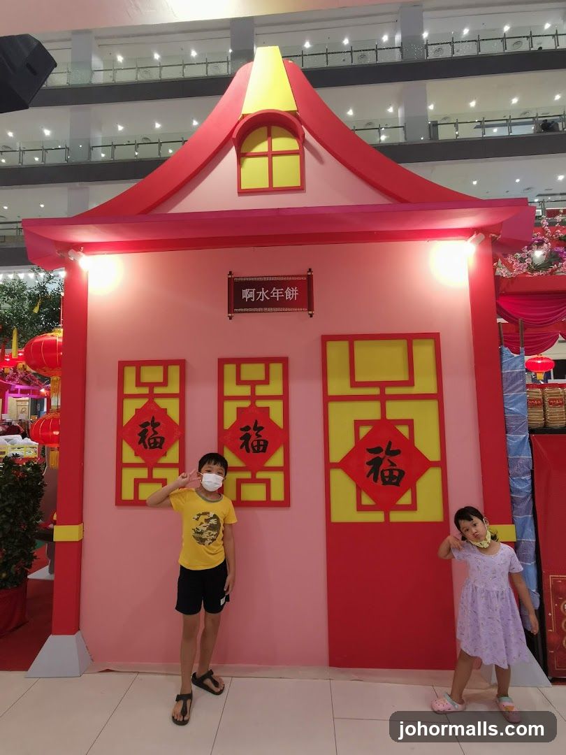 Children Posing in Front of a Festive Display
