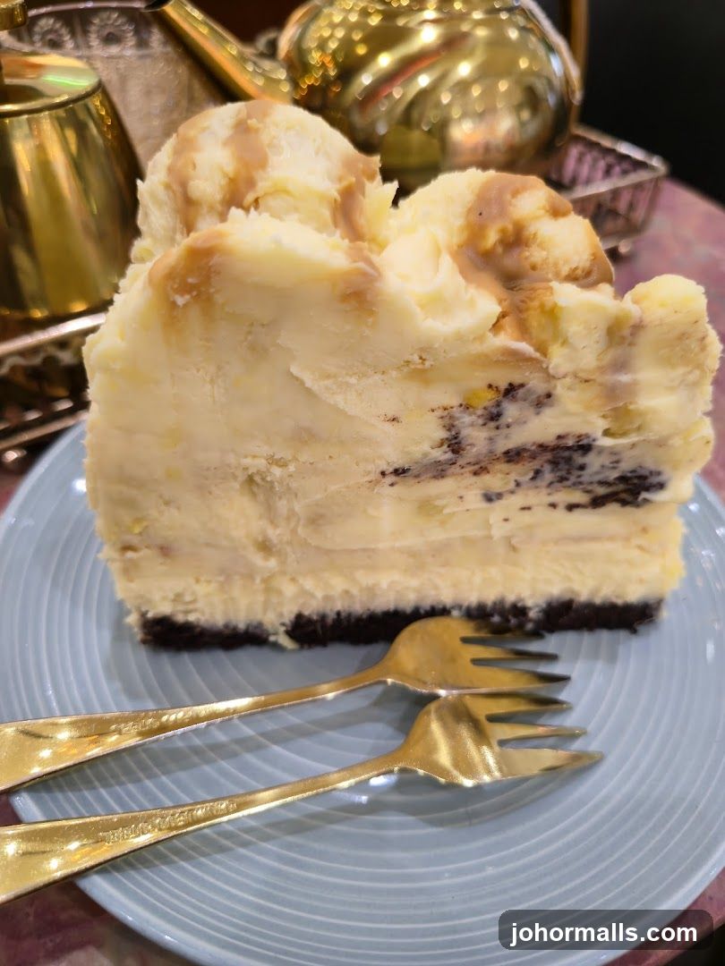Cheesecake Slice with Forks and Teapot
