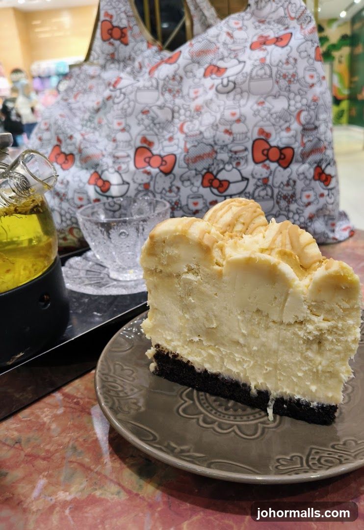 Cheesecake and tea set in café interior