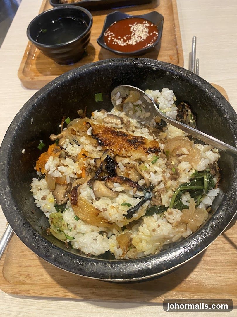 Stir-fried rice dish in stone bowl