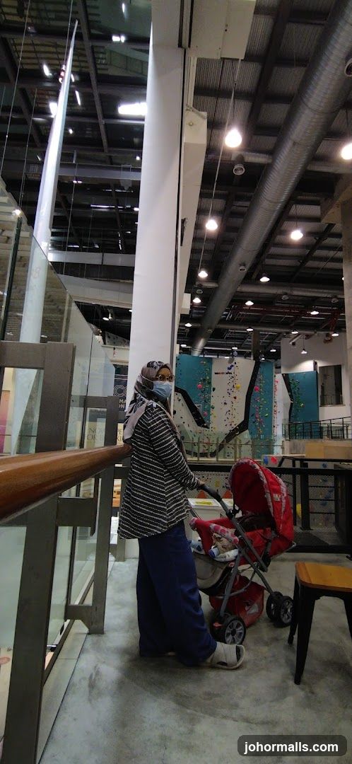 Interior of a multi-level facility with climbing walls