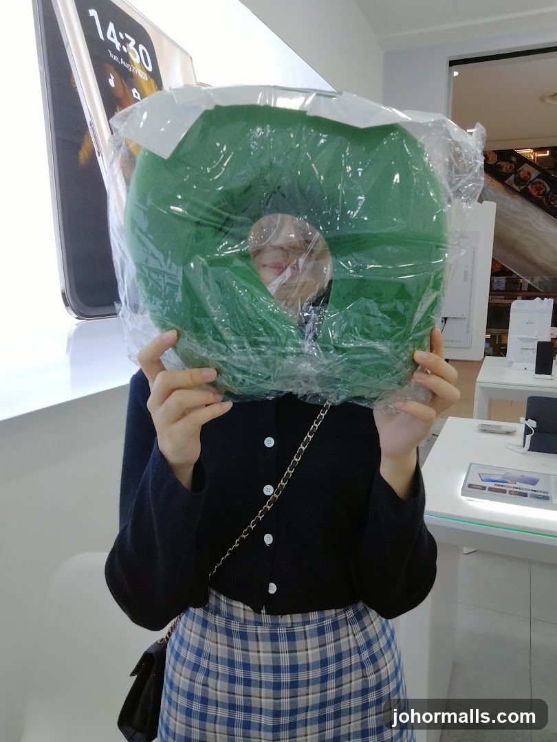 Person holding green product in store