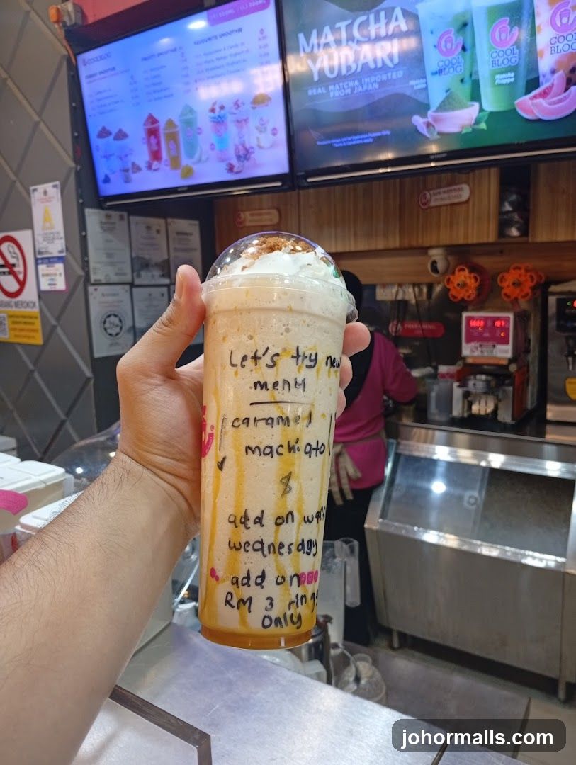 Customer holding drink in café