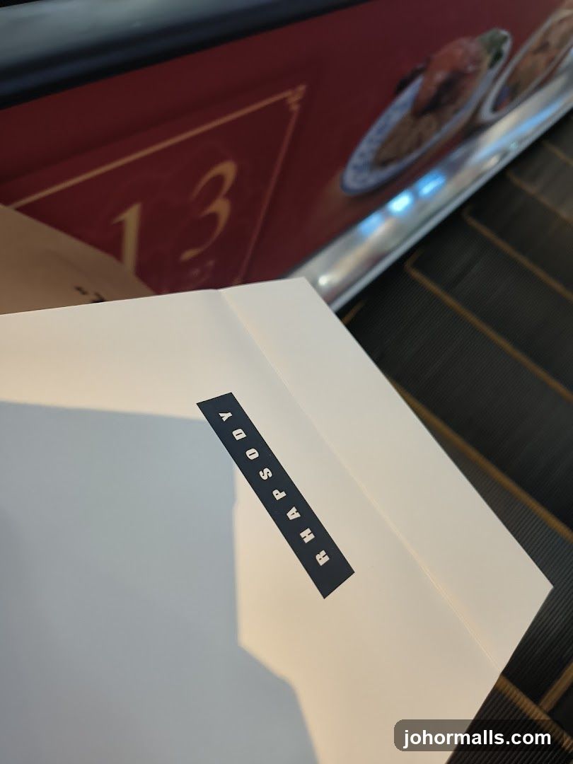Rhapsody Box on Escalator