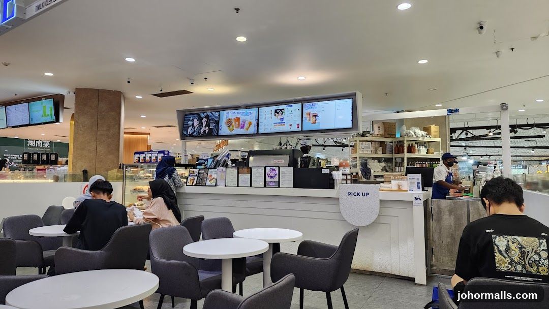 Café interior with customers and staff