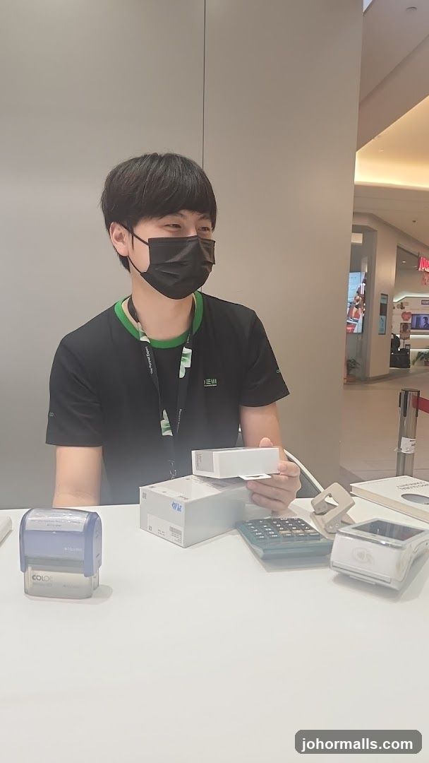 Staff at counter in shopping mall