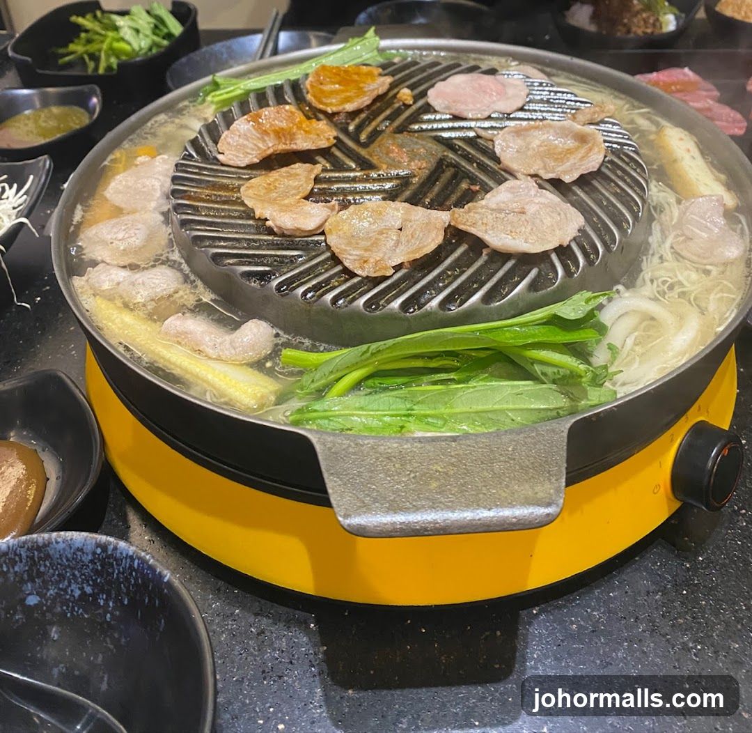 Grilled meat and vegetables on a hot pot