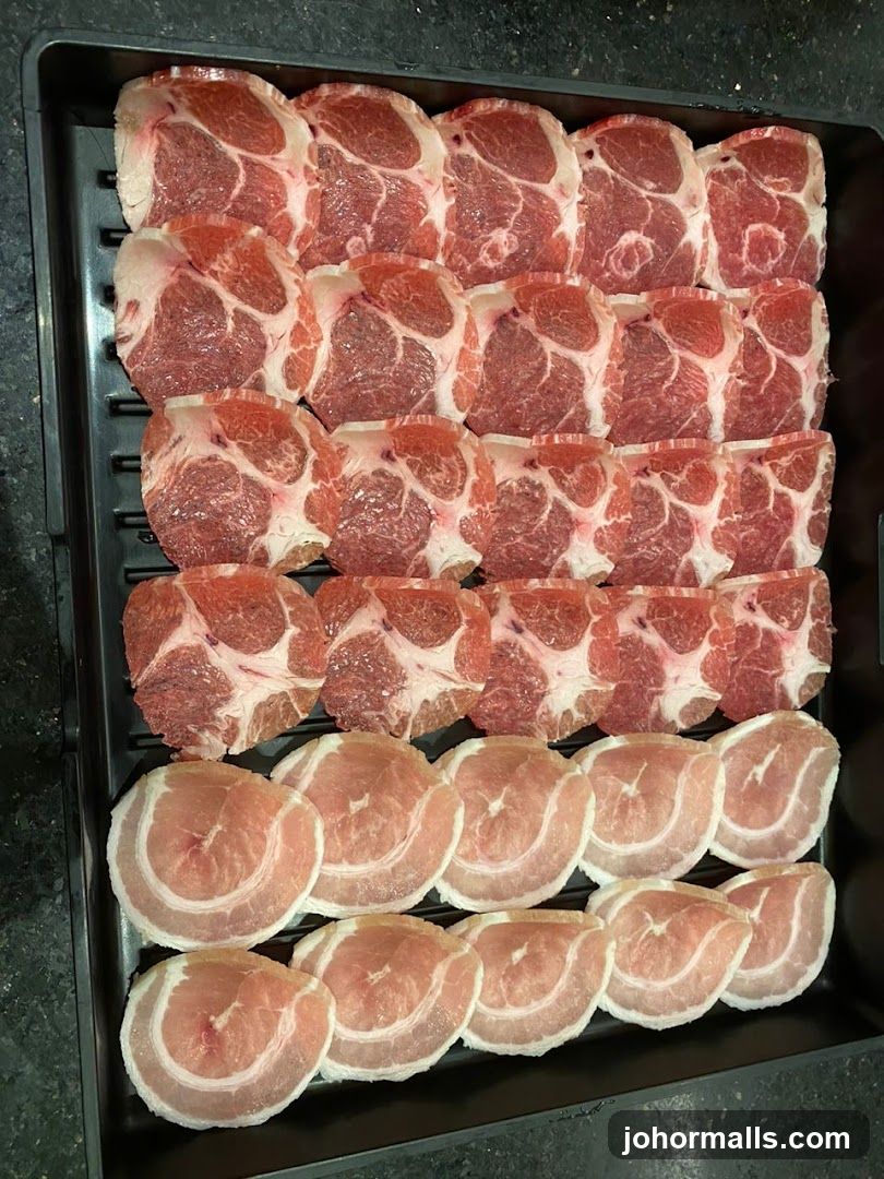 Raw meat slices in tray