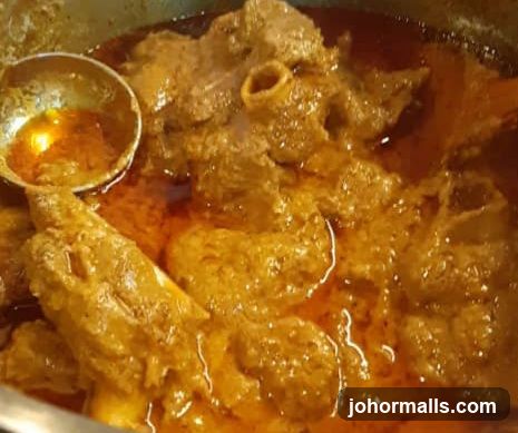 Cooked meat dish in sauce