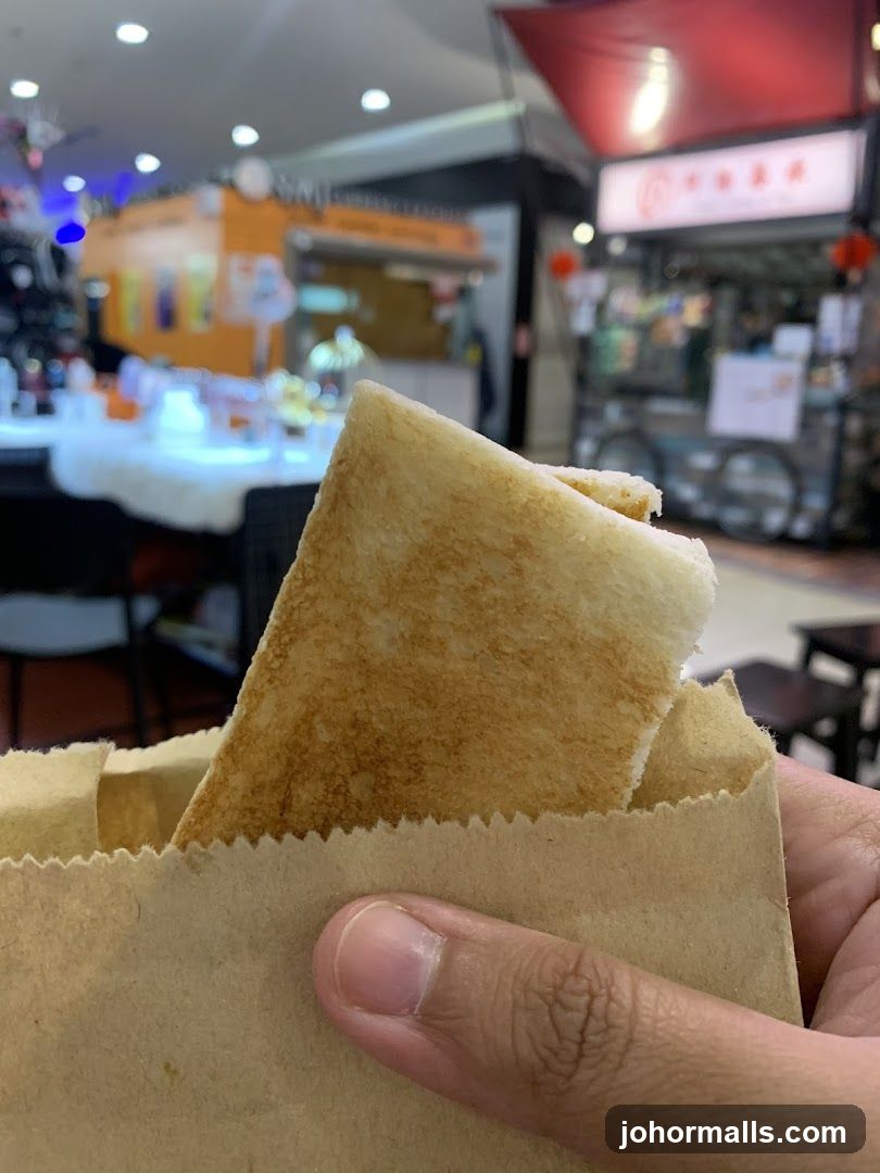 Hand holding food item